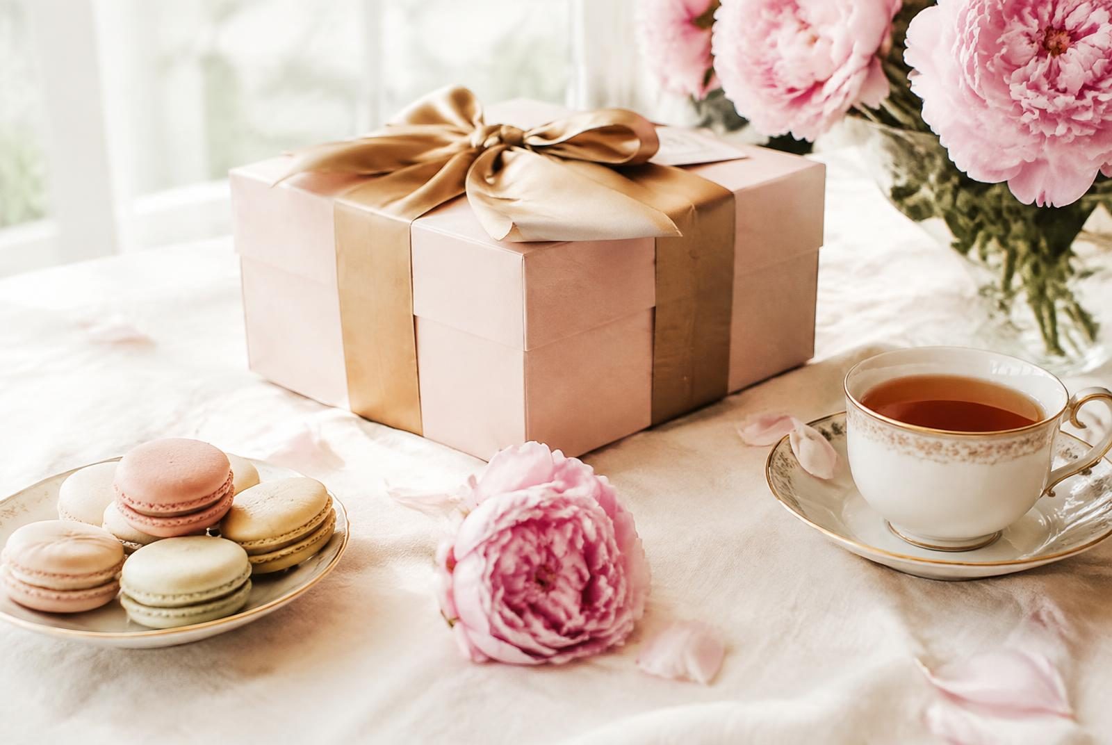 Blush gift box with gold ribbon, porcelain teacup and pink peonies
